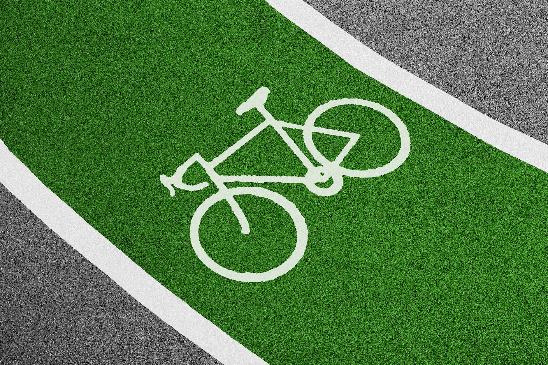 Cyclists riding in a dedicated cycling lane in an urban European city